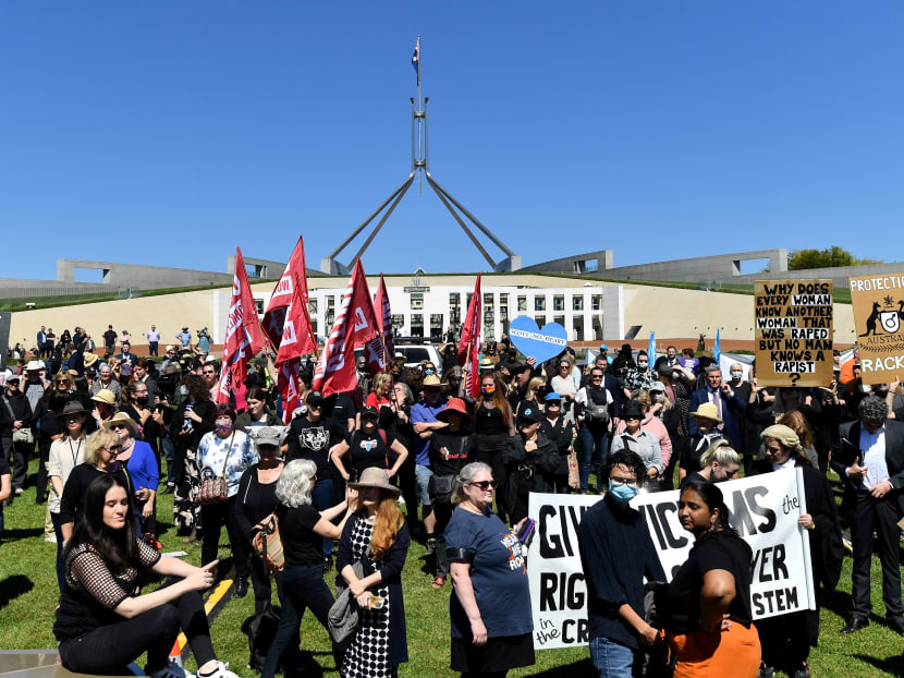 Protesters attend a rally against sexual violence and gender inequality in front of Parliament House in Australia's capital city Canberra on March 15, 2021.