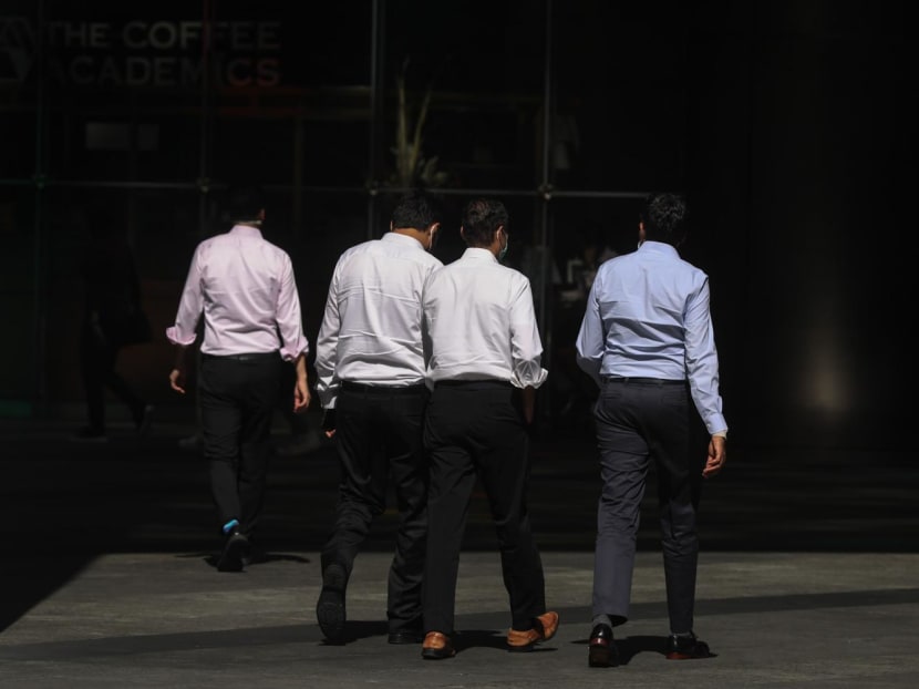 Officer workers walking in the Central Business District of Singapore. 