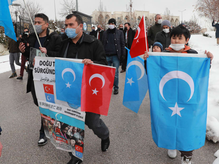 Uighurs attend a protest against the visit of China's State Councillor and Foreign Minister Wang Yi to the Turkish capital in front of the Chinese embassy in Ankara, Turkey on March 25, 2021.
