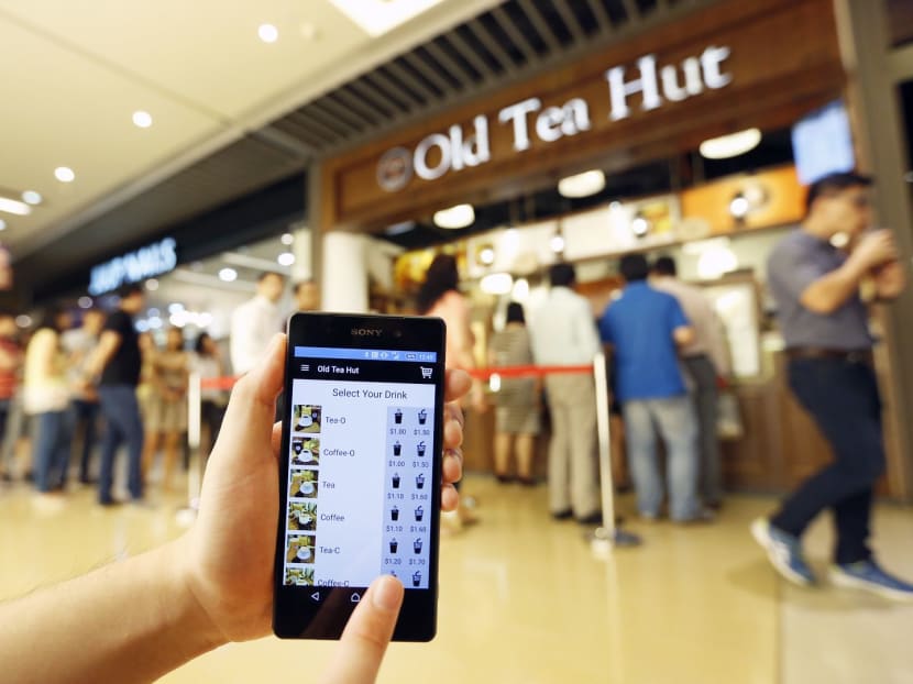 DBS Bank has started a contactless payment trial with Old Tea Hut, using a phone app called FasTrack. Queuing up time has been cut from 20 to six minutes. Photo: Ernest Chua