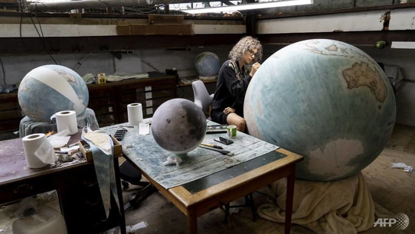 In a London workshop, artisans craft bespoke globes