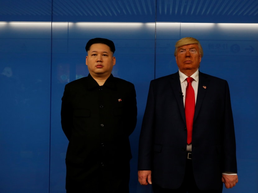 Mr Dennis Alan of Chicago, 66, who is impersonating US President Donald Trump, and Mr Howard, 37, an Australian-Chinese who is impersonating North Korean leader Kim Jong-un, wait for a subway train in Hong Kong on Jan 25, 2017. Photo: Reuters