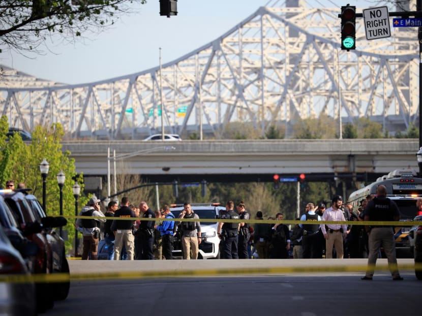 Law enforcement officers respond to an active shooter near the Old National Bank building in Louisville, Kentucky on April 10, 2023. Law enforcement officers respond to an active shooter near the Old National Bank building in Louisville, Kentucky on April 10, 2023.