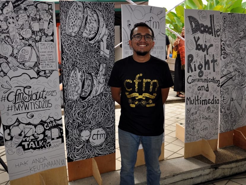 Doodle addict Afiq Afify standing next to his work. Photo: The Malaysian Insider