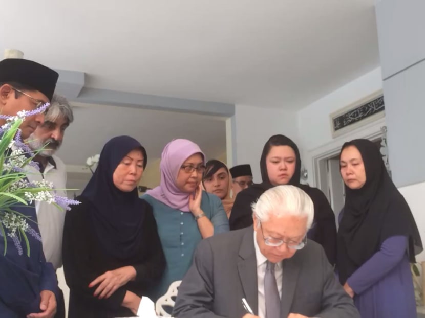 President Tony Tan pays his respects as members of Othman Wok's family look on. Photo: Jason Quah