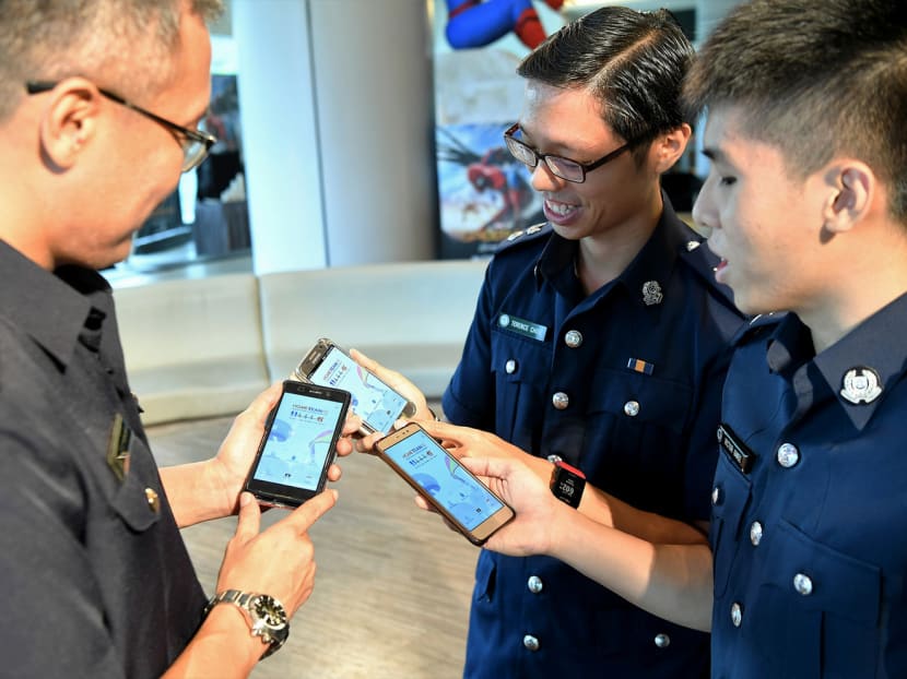 From left: LTC (NS) Mohamed Razaleigh (SCDF), DSP Terence Matthew Choo (SPF) and NS Probationary Inspector Victor Gwee (SPF) checking out the app. Photo: HomeTeamNS