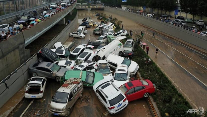 City in China's Henan province picks through debris after record rains kill 33 City in China's Henan province picks through debris after record rains kill 33