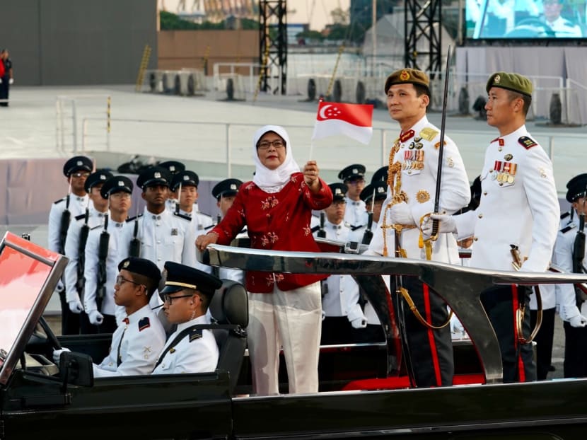 Speaker of Parliament Halimah Yacob observes the NDP preview as reviewing officer on July 29. Mdm Halimah has been one of the reviewing officers for the parade preview since 2013, when she was appointed as Speaker. Photo: Mugilan Rajasegeran/TODAY