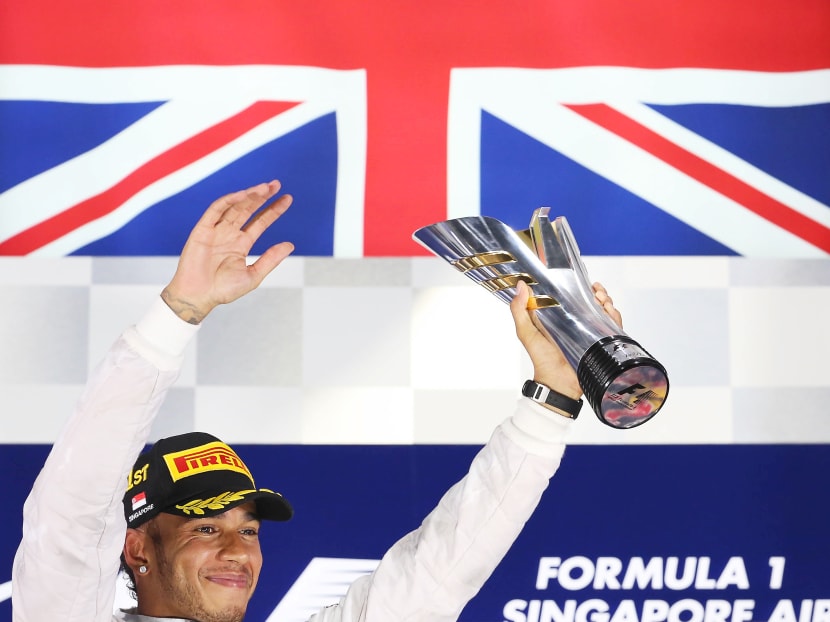 Lewis Hamilton celebrates winning the Singapore Grand Prix. Photo: DON WONG