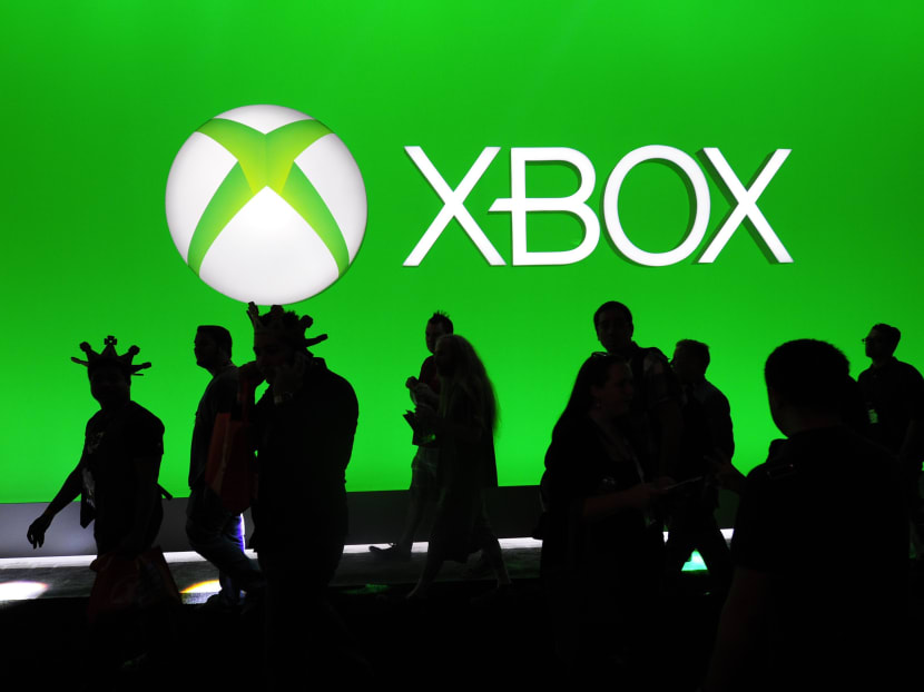 Visitors to the E3 convention walking past the Xbox booth. Photo: Reuters