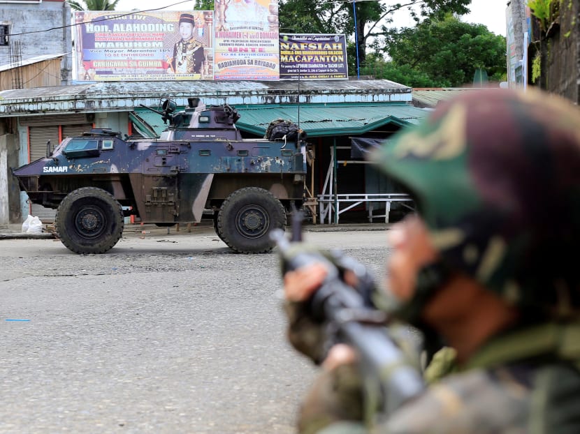 Government troops are seen during their assault with insurgents from the so-called Maute group, who have taken over large parts of the Marawi city, southern Philippines May 25, 2017. Photo: Reuters