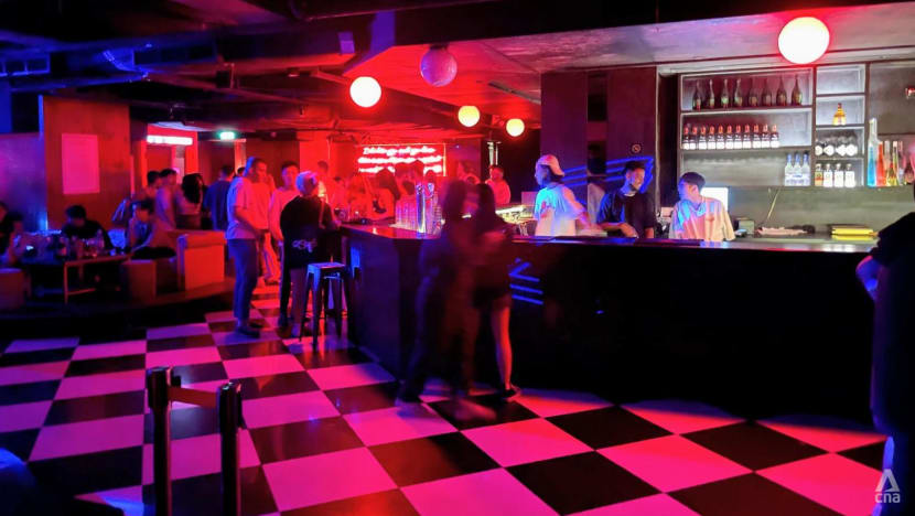Loud music, muted crowds: Quiet start to nightlife businesses' reopening -  CNA