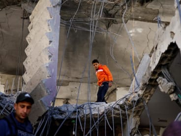 A Palestinian boy reacts at the site of an Israeli strike on a house, amid the ongoing conflict between Israel and the Palestinian Islamist group Hamas, in Rafah, in the southern Gaza Strip on March 25, 2024.
