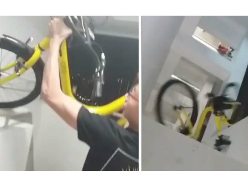 A video making its rounds on social media shows a man lifting up and throwing down an ofo bicycle from a high-rise building. Photo: Social Media