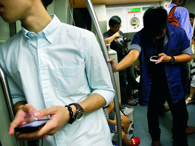 SingTel is considering the use of data analytics to ensure a faster and smoother surfing experience for users, especially during the morning rush hour. 
Photo: Reuters