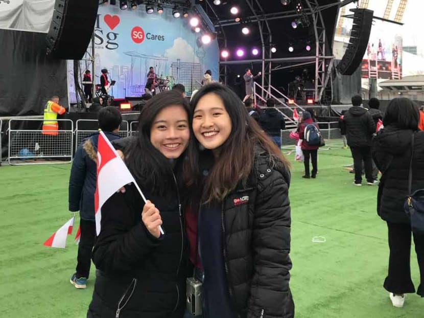 The writer (seen here on the left at a Singapore Day event in London this year) says that despite being an introvert who values her me-time, she misses having someone by her side during her travels.