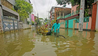 Two million stranded as worst floods in decades hit Bangladesh's northeast