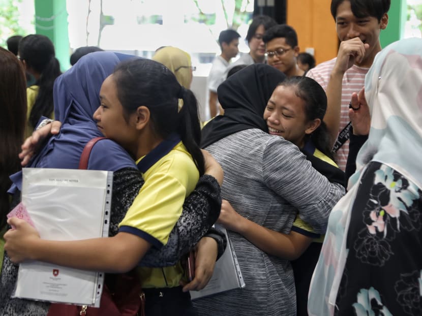Students at Kranji Primary School getting their Primary School Leaving Examination (PSLE) results. A total of 40,256 Primary 6 students sat for the PSLE this year.