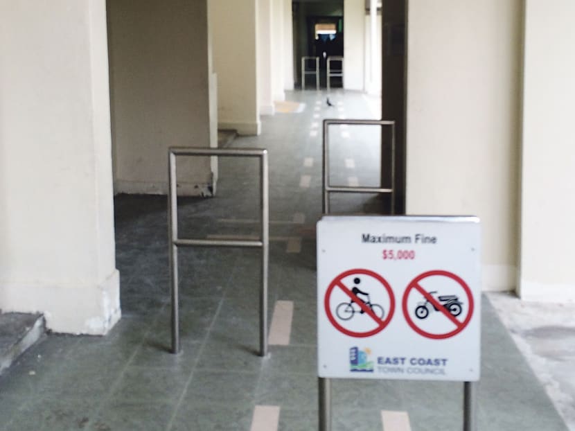 Barriers to deter cyclists at some public apartment blocks are hindrances to wheelchair mobility. Photo: Tan Chek Wee