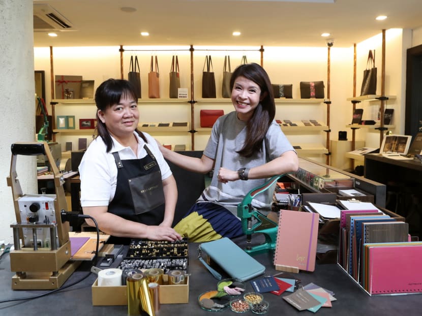 Ms Tan Buay Heng (left) rose from being a production operator to a retail branch manager at Bynd Artisan, which was started by Ms Winnie Chan (right), the third generation running a family business that used to print notebooks. Photo: MCI