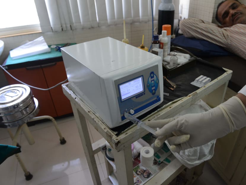 A consultant preparing an ozone therapy injection for a patient in Ahmedabad on April 7, 2016. Some centres in Malaysia are still available for ozone therapy despite the recent crackdown. Photo: AFP
