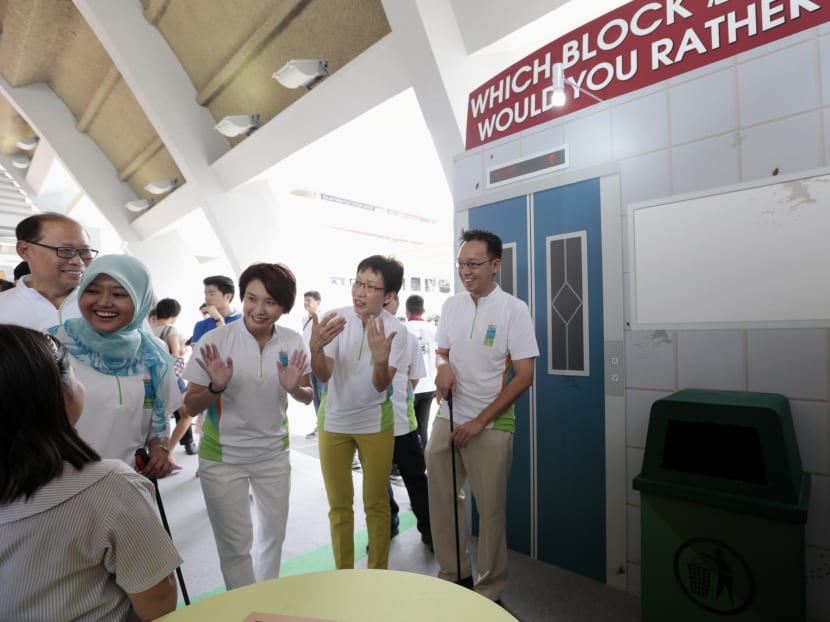 Minister Grace Fu with Mr David Ong, Ms Low Yen Ling, Mr Tan Wu Meng and Mdm Rahayu Mahzam as they visit a booth at the South West Clean and Green SG50 Carnival where the Cool CC programme was launched, on Oct 4, 2015. Photo: Jason Quah