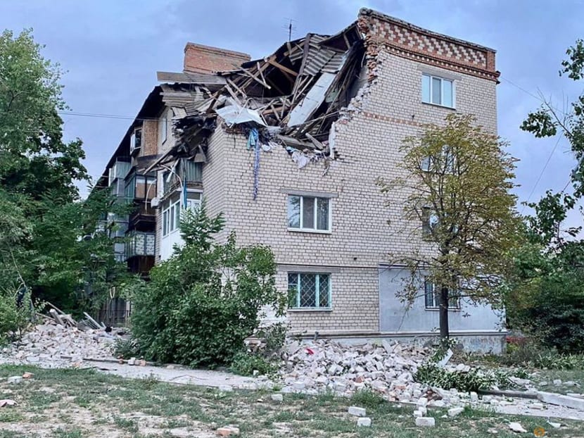 A view shows a residential building damaged by a Russian military strike, as Russia’s attack on Ukraine continues, in location given as the town of Nikopol, Dnipropetrovsk region, Ukraine August 11, 2022.  Press service of the State Emergency Service of Ukraine/Handout via REUTERS 