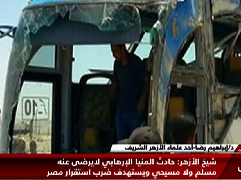 An image grab taken from Egypt's state-run Nile News TV channel on May 26, 2017 shows the remains of a bus that was attacked while carrying Egyptian Christians in Minya province. Photo: Nile News via AFP