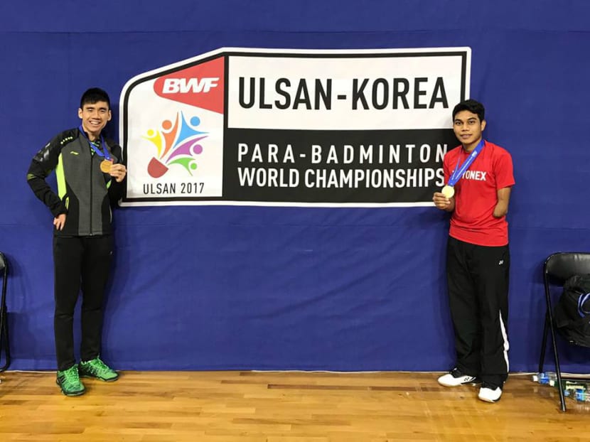 Tay Wei Ming (left) with his partner Suryo Nugroho at the Para-Badminton World Championships. Photo: Singapore Disability Sports Council