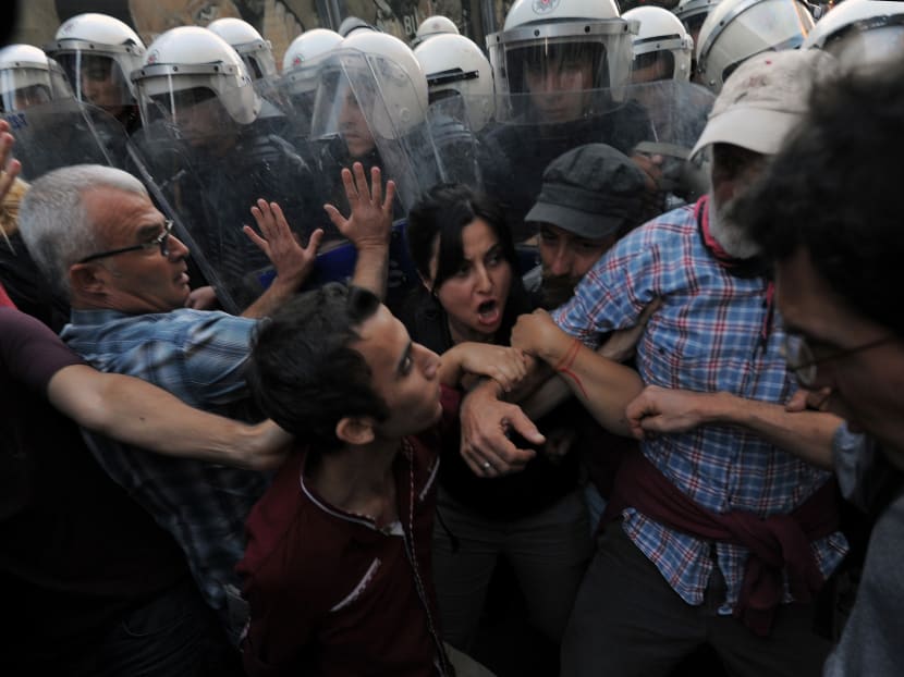 Demonstrators clashes with riot police as they protest the death of 22-year-old Mr Ahmet Atakan in Antakya Monday night, in Istanbul, Turkey, Tuesday, Sept 10, 2013. Photo: AP