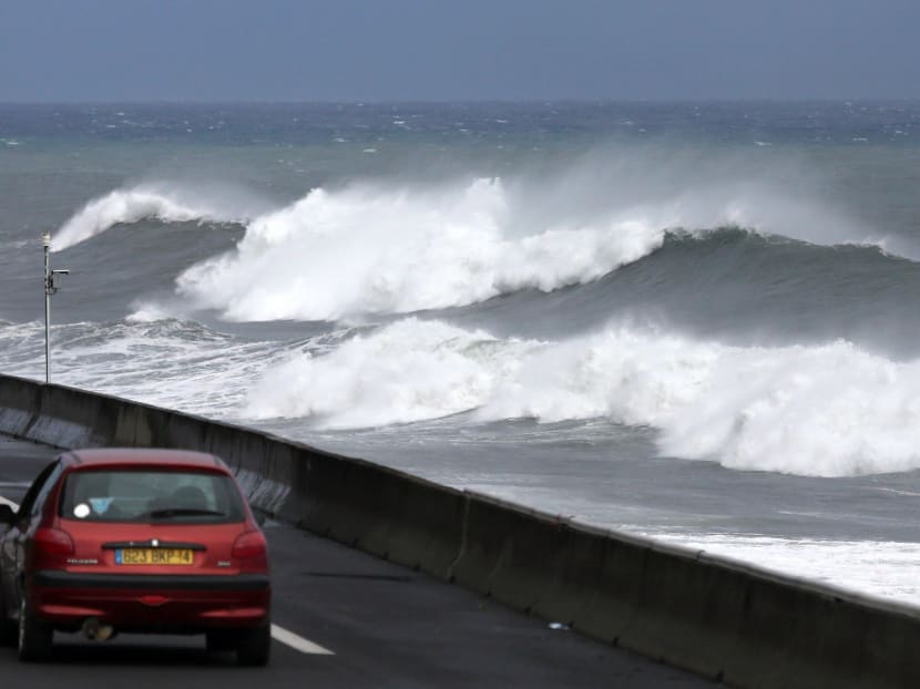 AFP file photo of waves crashing off the coastline of the French Indian Ocean island of La Reunion.