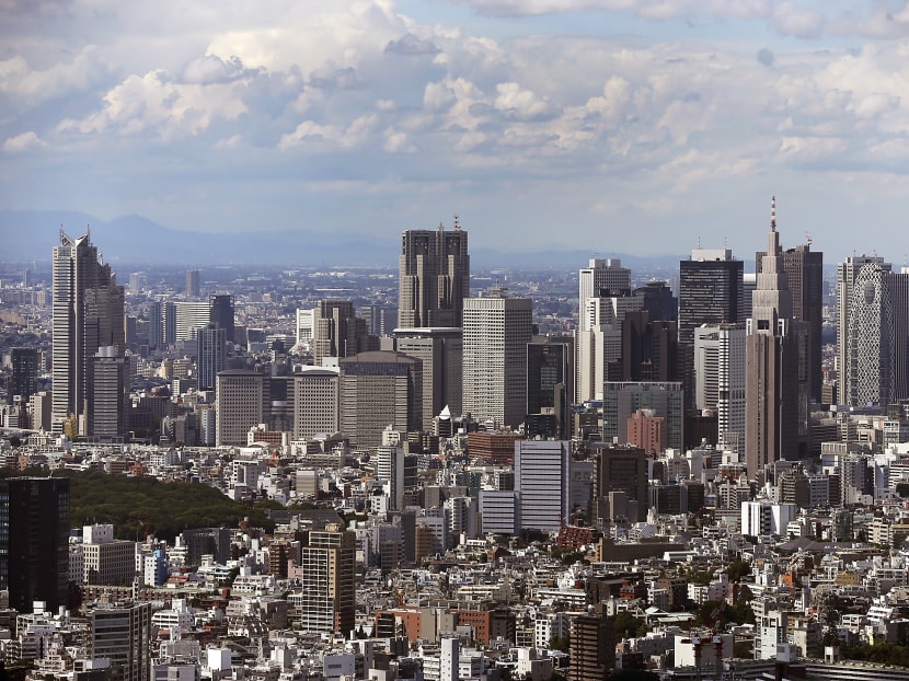 Commercial and residential buildings in the Shinjuku district are seen from the observatory in the Roppongi Hills Mori Tower, in Tokyo, Japan, on Sept 3, 2013. Photo: Bloomberg