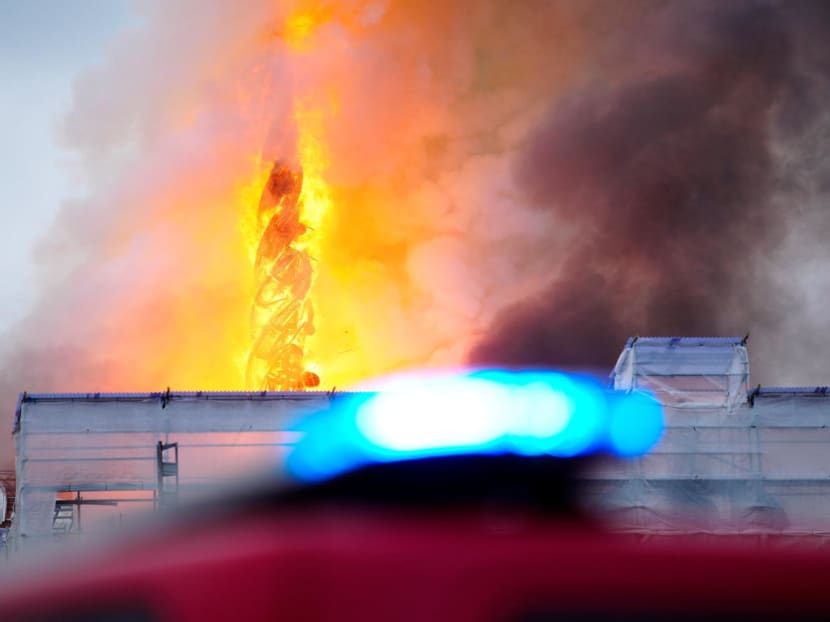 Smoke billows during a fire at the Old Stock Exchange, Boersen, in Copenhagen, Denmark on April 16, 2024. 