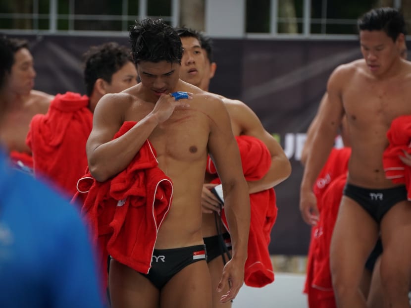 The Singapore waterpolo players looking pensive and dejected after being given a scare by Indonesia. Photo: Jason Quah / TODAY