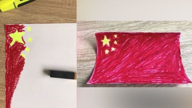 在乌中国人用口红画五星旗 “真没有了我拿血画”