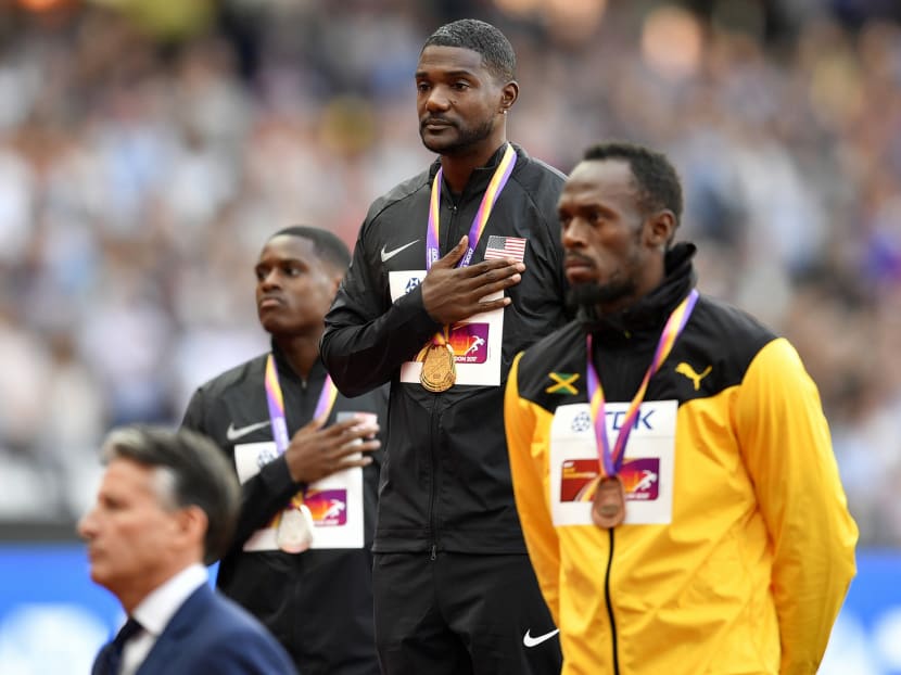 American Justin Gatlin (centre) with compatriot and silver medallist Christian Coleman (left), and Jamaica’s Usain Bolt who finished third, on the podium at the World Athletics Championships on Sunday. Fans showered Gatlin with boos after his win. Photo: AP