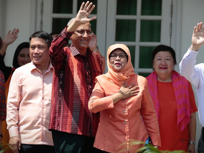 President-elect Halimah Yacob and her husband, Mr Mohamed Abdullah Alhabshee, waving at her supporters at the Nomination Centre at the People's Association HQ on Wednesday.  Photo: Jason Quah/TODAY
