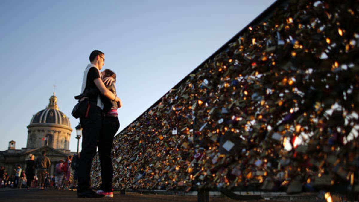 Paris Pont des Arts bridge collapses under weight of 'love locks' left by  tourists