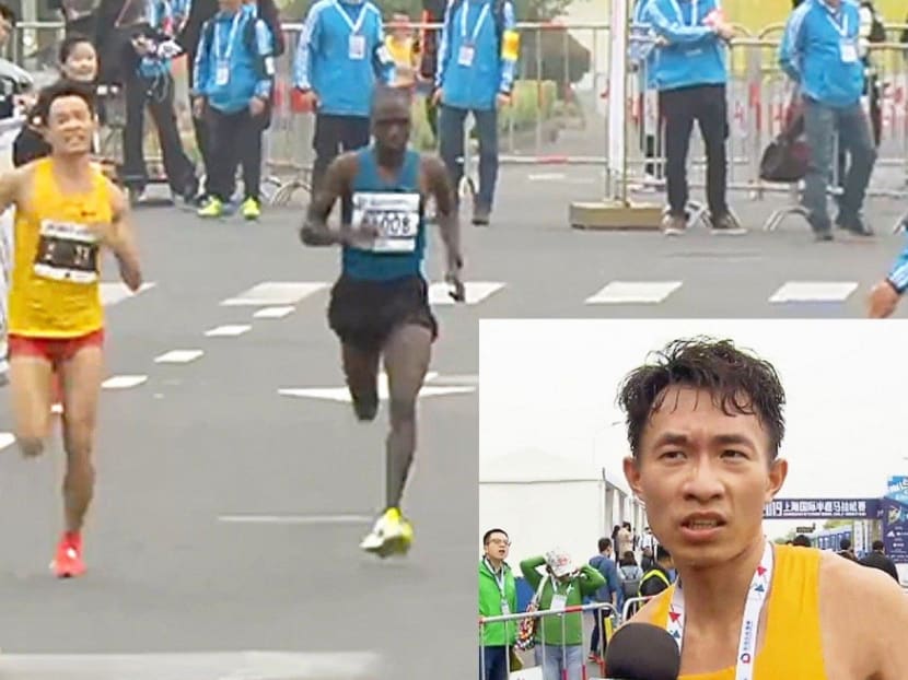 Wu Xiangdong sprints to the finish to become China’s top finisher at the Shanghai international half-marathon. He was later interviewed on TV.