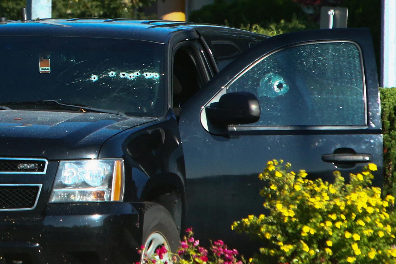 A vehicle with bullet holes visible on the windshield is seen after authorities alerted residents of multiple shootings targeting transient victims in the Vancouver suburb of Langley, British Columbia, Canada on July 25, 2022. A vehicle with bullet holes visible on the windshield is seen after authorities alerted residents of multiple shootings targeting transient victims in the Vancouver suburb of Langley, British Columbia, Canada on July 25, 2022. 