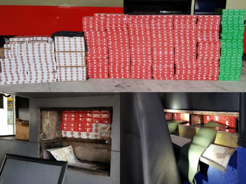 More than 1,000 cartons of duty-unpaid cigarettes were seized from a Singapore-registered tour bus at the Tuas Checkpoint on Wednesday (Feb 7). Photo: ICA