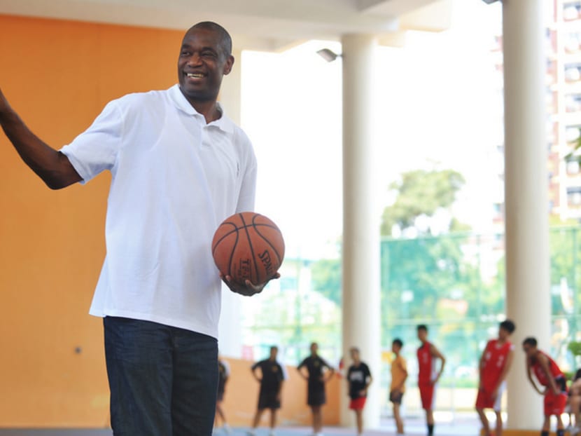NBA Hall of Famer Dikembe Mutombo, showing his "No No No" signature finger wag while having a basketball clinic with the 50 Dunman Secondary School students at the Dunman Secondary’s indoor basketball court yesterday. PHOTO: KOH MUI FONG