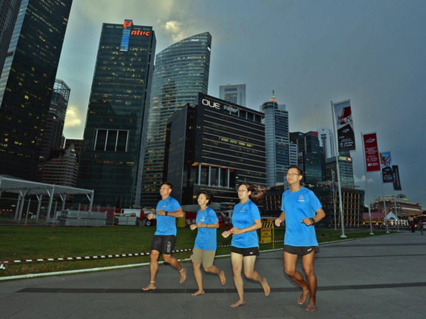 (From left) Peter Loong, Anna Ong, Dawn Ng and Hayden Tan are members of the Singapore Barefoot Minimalist group, which has grown from five to some 950 members since it was formed in 2013. Photo: Robin Choo