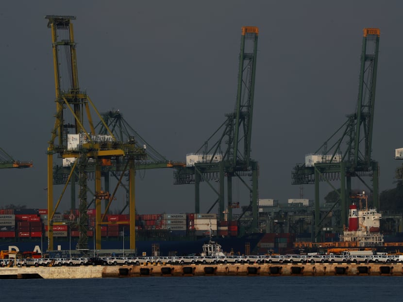 A view of new cars parked at Tanjong Pagar Container Terminal in Singapore on March 9, 2020. Ports are a vital component to Singapore’s economy, the authors note.