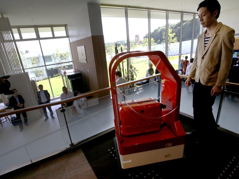 Robots do check-in and check-out at cost-cutting Japan hotel