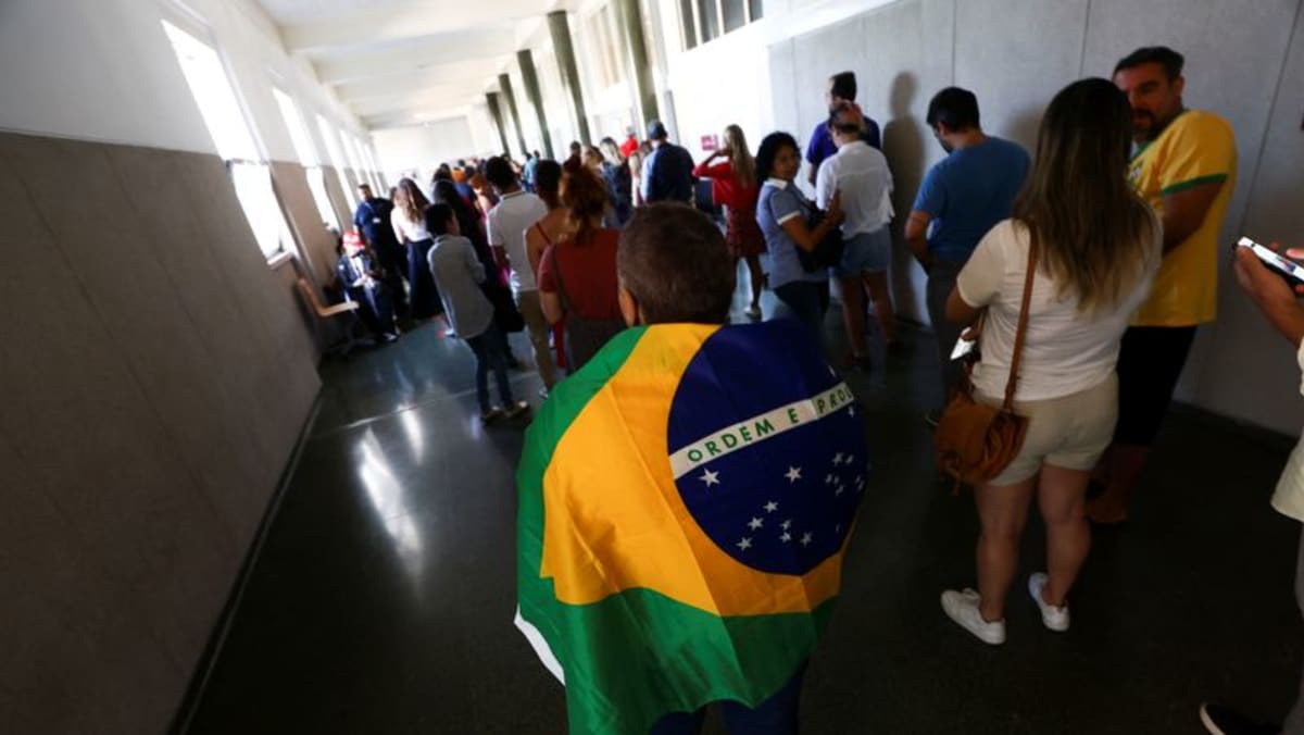 Tensions high as Brazilians on other side of Atlantic cast ballots