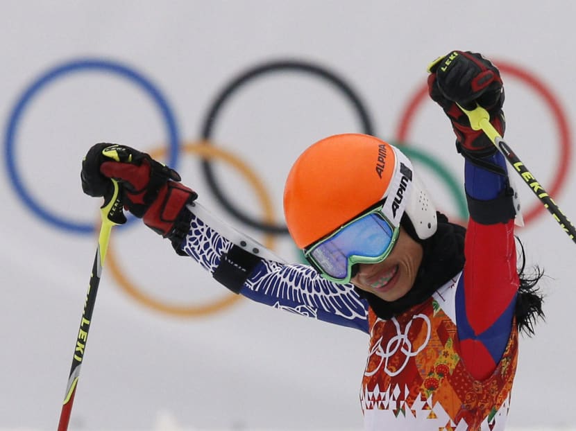 In this Tuesday, Feb. 18, 2014 file photo, violinst Vanessa Mae starting under her fathe'sr name as Vanessa Vanakorn for Thailand celebrates after completing the first run of the women's giant slalom at the Sochi 2014 Winter Olympics. Photo: AP