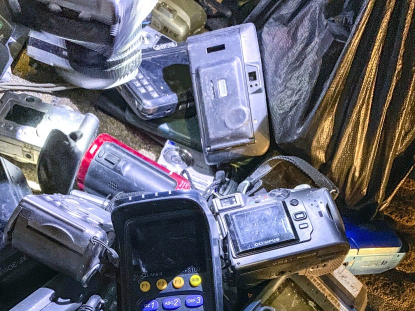 The night market is full of second-hand electronic devices such as radios and feature phones.