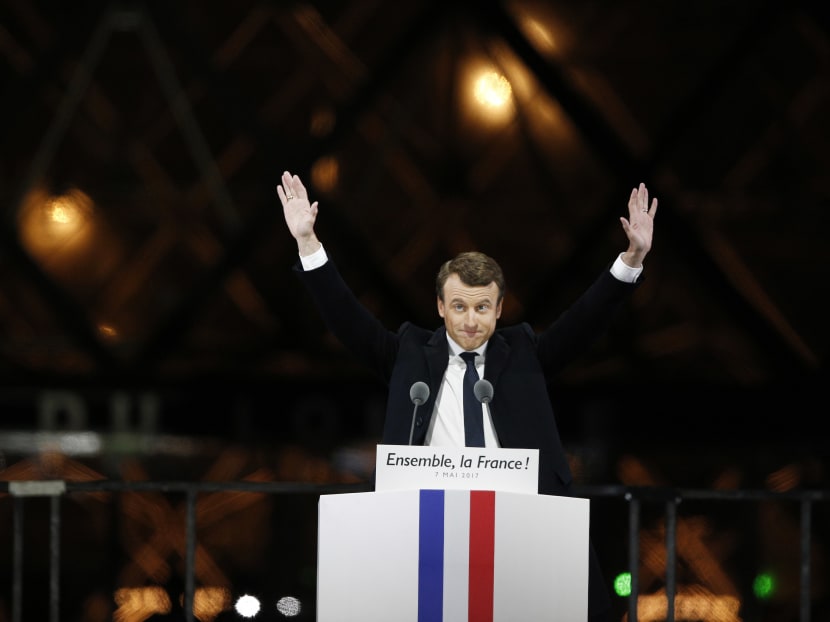 French President-elect Emmanuel Macron gestures during a victory celebration outside the Louvre museum in Paris, France, Sunday, May 7, 2017. Speaking to thousands of supporters from the Louvre Museum's courtyard, Macron said that France is facing an "immense task" to rebuild European unity, fix the economy and ensure security against extremist threats. Photo: AP