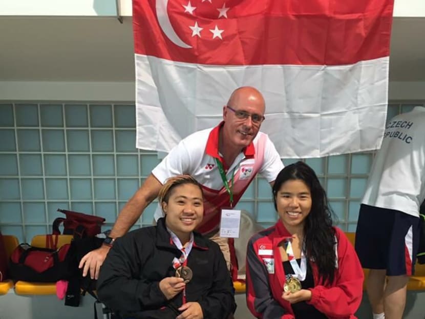 Yip Pin Xiu (right) posing together with fellow Team Singapore para-swimmer Theresa Goh and their swim coach Mick Massey. Photo: Mick Massey/Facebook